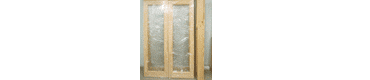 Фото двустворчатой двери из массива сосны с панорамным стеклопакетом  