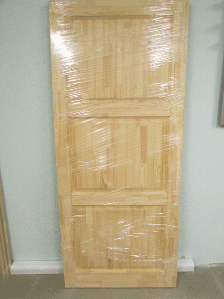 Деревянная дверь АЛЕКСАНДРИЯ после изготовления. Готова под покраску. Упакована в плёнку.